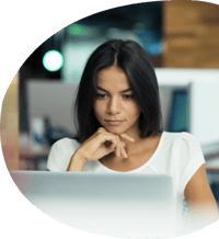 Portrait of a serious businesswoman using laptop in office